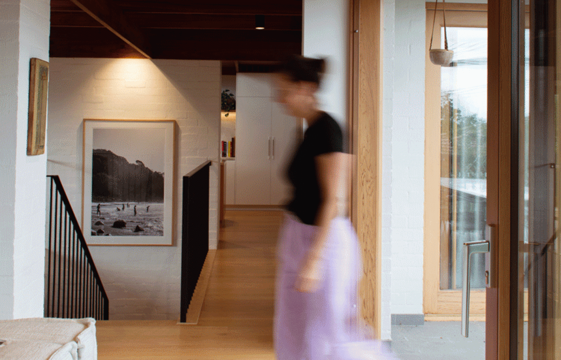 woman walking through room