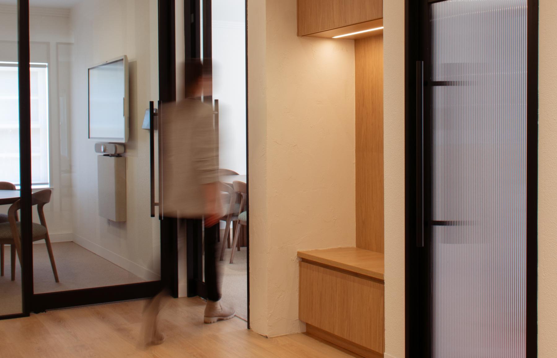 woman walking through office space