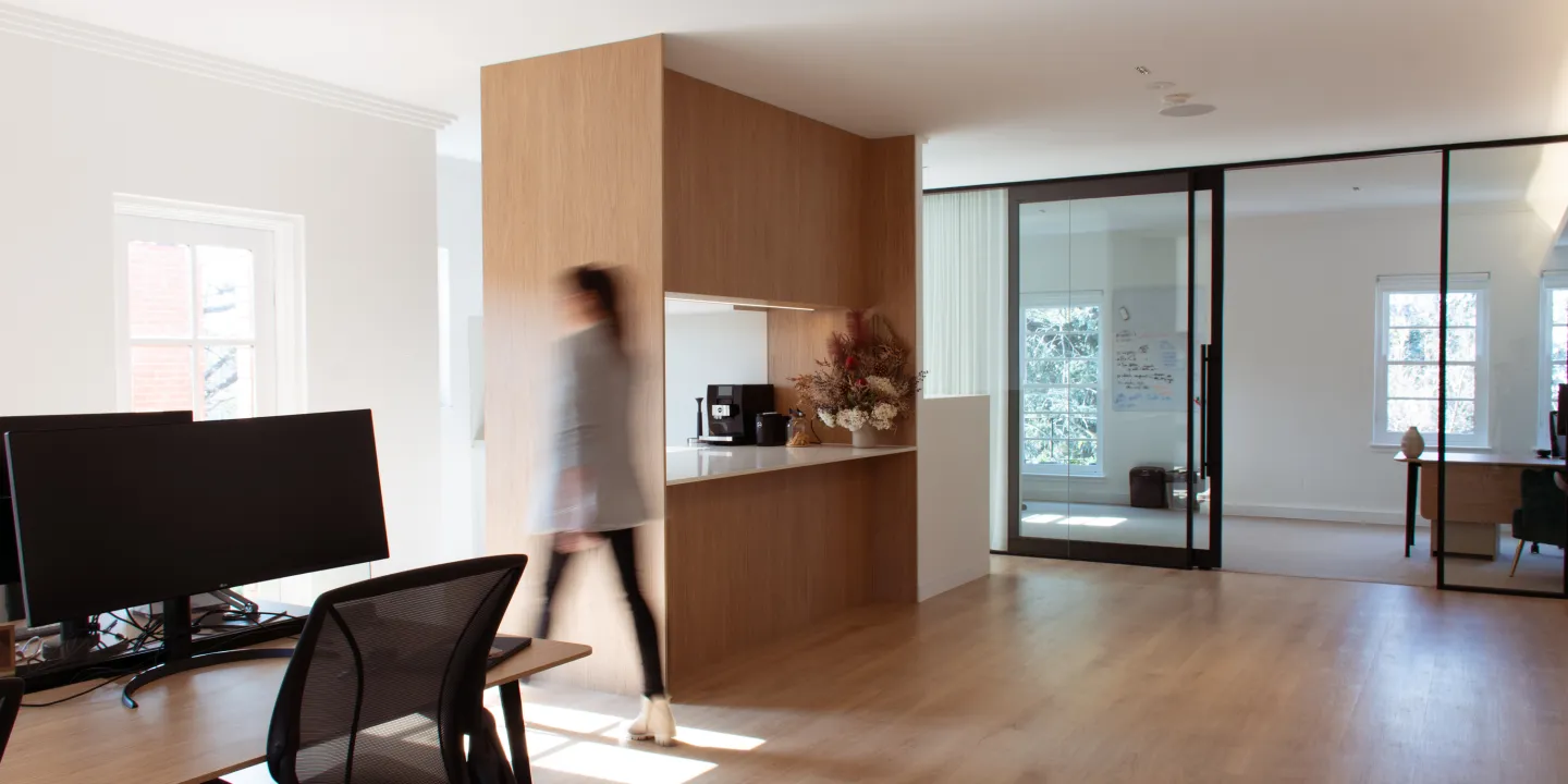 woman walking through office space